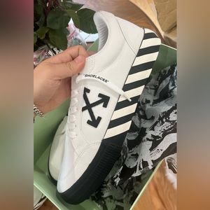 never been worn. Off White. Low vulcanized white.